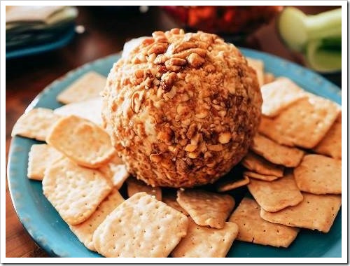 cheeseball coated with chopped pecans